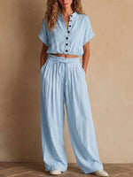 Two-piece Linen Set Featuring A Cropped, Half-button Top With A Stand Collar, Wooden Buttons, And Roll-up Sleeves, Paired With Wide-leg Trousers Featuring An Elastic Drawstring Waist