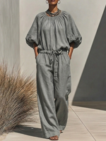 Gathered Round-neck Linen Wide-leg Jumpsuit With Lantern Sleeves And A Drawstring Waist
