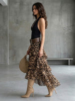 Two-piece Set Featuring A Stylish Cotton Halter-neck Sleeveless Top And A Leopard-print Ruffled Chiffon Skirt.