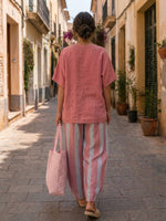 Two-piece Set Featuring A Casual Linen-cotton Top And Striped Trousers.