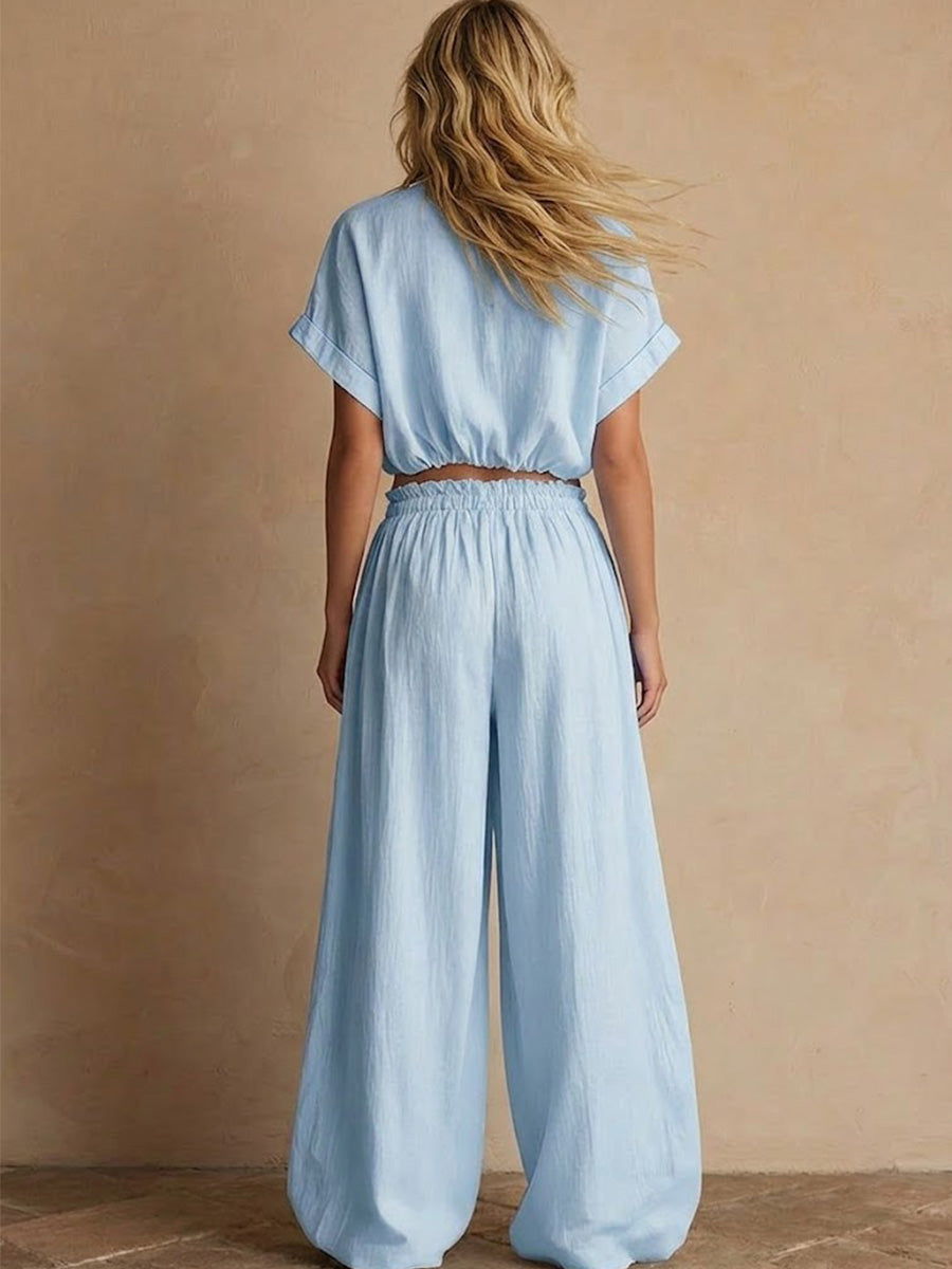 Two-piece Linen Set Featuring A Cropped, Half-button Top With A Stand Collar, Wooden Buttons, And Roll-up Sleeves, Paired With Wide-leg Trousers Featuring An Elastic Drawstring Waist