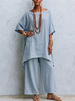 Two-piece Set Featuring A Boat-neck Linen Top With Batwing Sleeves And An Asymmetrical Hem, Paired With Wide-leg Trousers