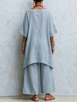Two-piece Set Featuring A Boat-neck Linen Top With Batwing Sleeves And An Asymmetrical Hem, Paired With Wide-leg Trousers