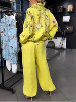 Two-piece Set Featuring A Loose, Casual Floral-print Linen-cotton Shirt And Solid-colored Trousers.